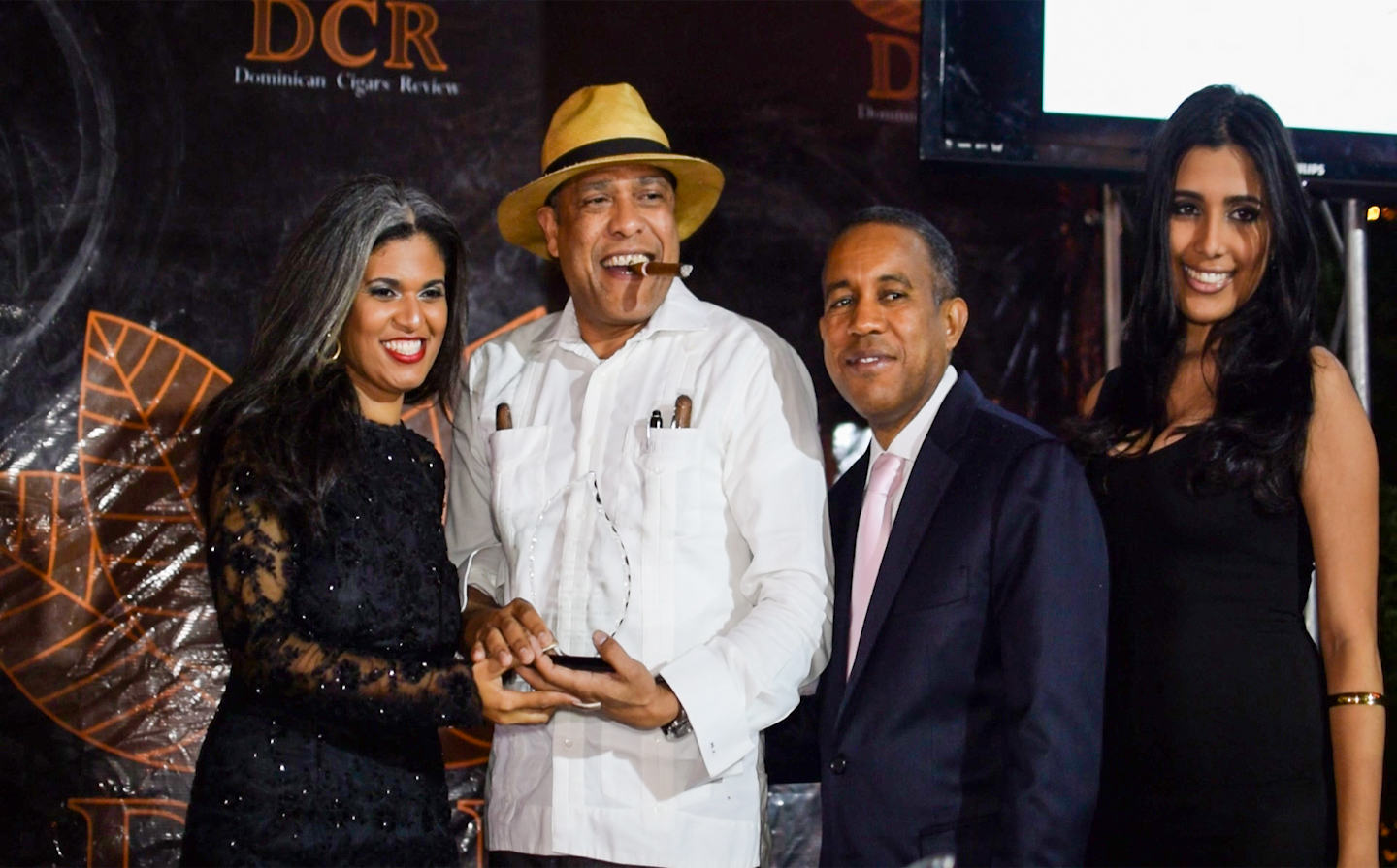 Manuel Inoa (hat) of La Aurora accepts the award for best cigar personality in the Dominican Republic.